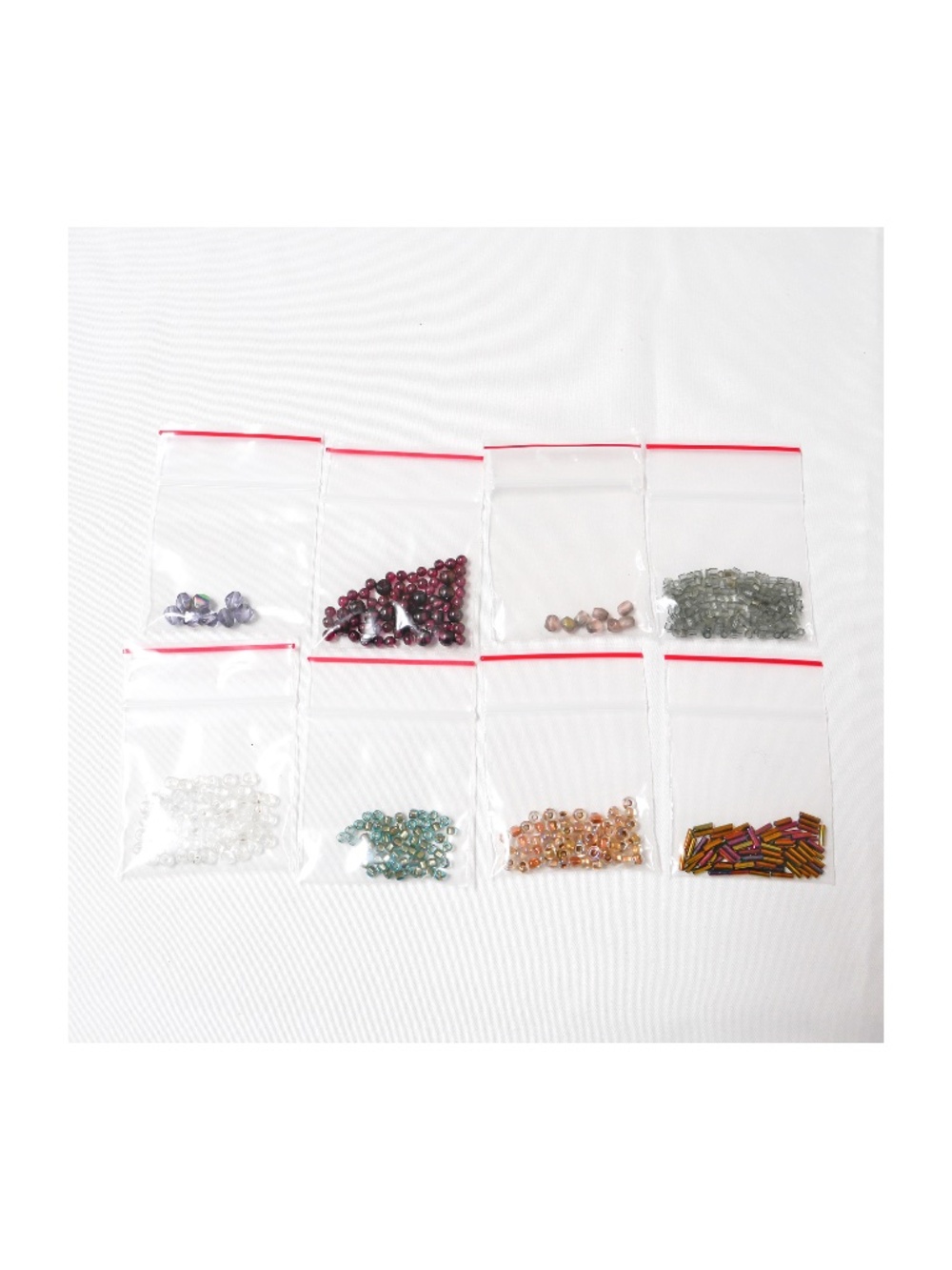 8 bags of glass beads, new but not in original packaging